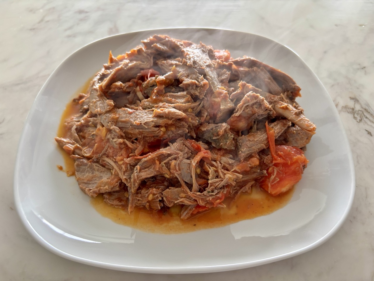 Shredded lamb in heirloom tomatoes